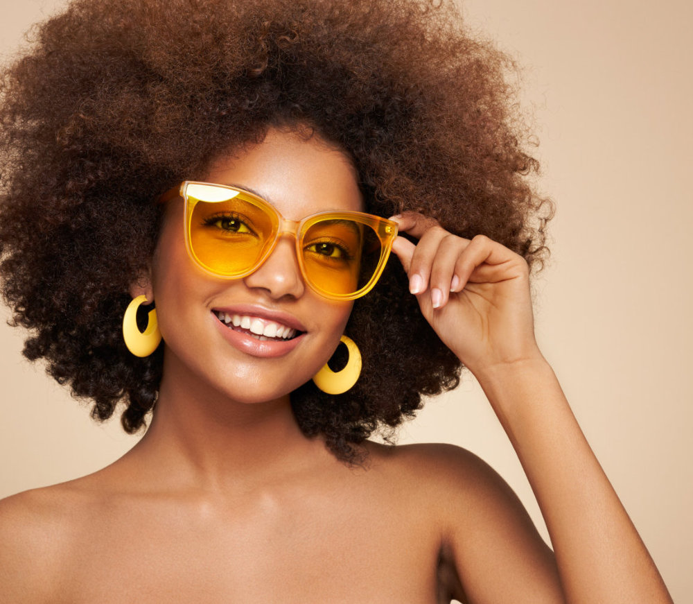 Beauty portrait of woman with afro posing in studio 